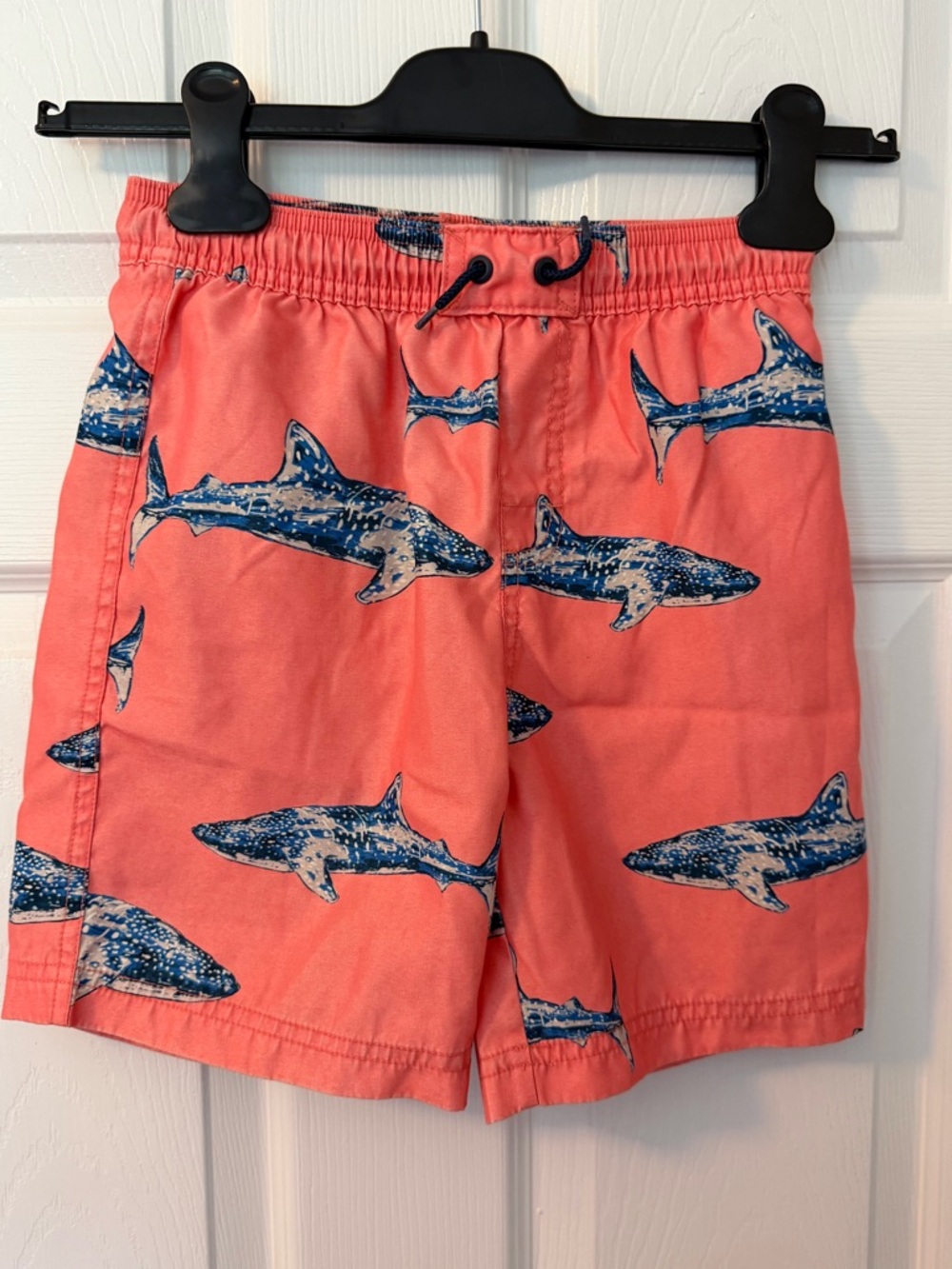 Tea Collection Coral Swim Trunks with Blue Shark Motif